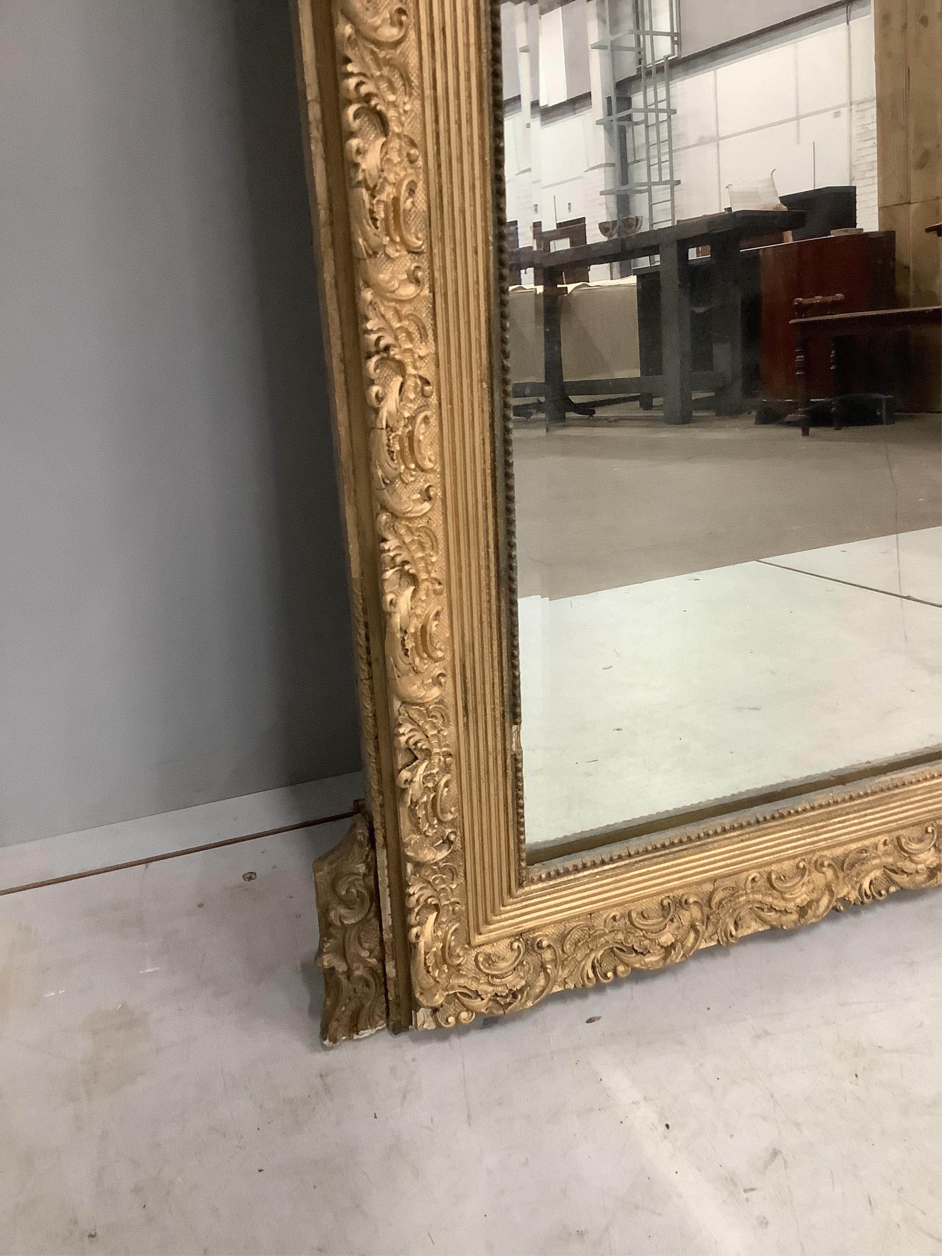 A 19th century French giltwood and composition wall mirror, width 84cm, height 131cm. Condition - poor to fair